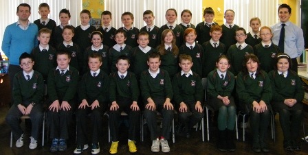 Mr Rice (St. Brigid's High School) and Mr Devlin (St. Mary's Teaching College Belfast) picture with primary 7.